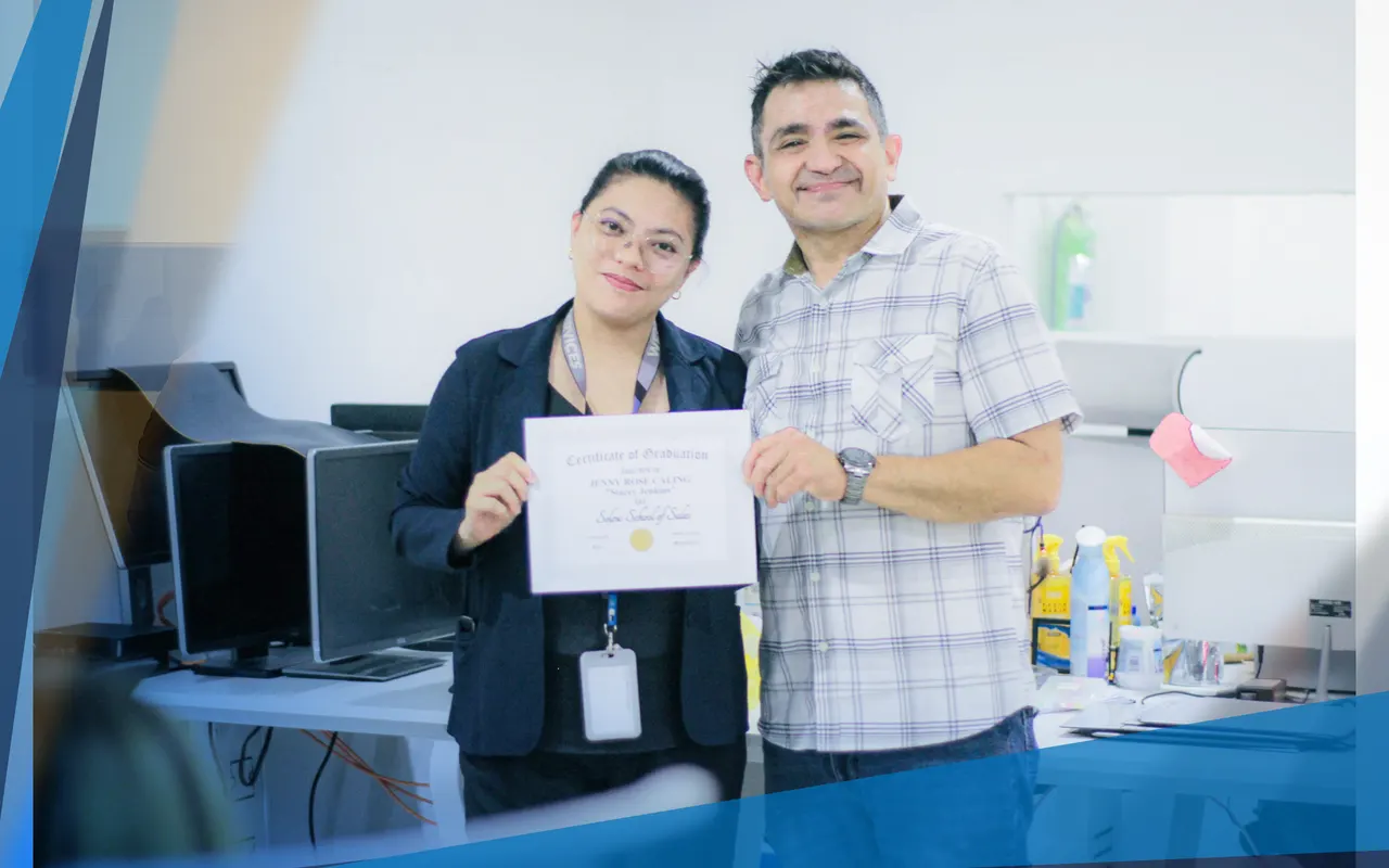 A team member receiving her certificate of graduation